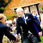 groom shakes bestmans hand